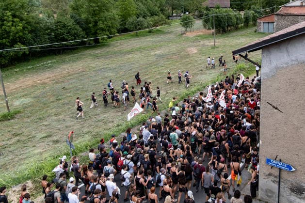 July 25, 2026, Susa, Piedmont, Italy: On July 25, 2026, thousands of people departed from AltaFelicito , a music festival in Venaus, to reach the construction sites of the TAV (High speed rail), a railway project to connect Italy and France. The demonstrators managed to enter the site and there clashed with the police, who responded with tear gas. Many of the buildings inside were put on fire, including two police vehicles. The TAV project has been highly contested during the last 30 years because of environmental damages and increasing costs. Susa Italy  - ZUMAs377 20260725_znp_s377_015 Copyright: xPietroxStariccox