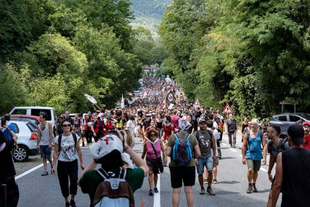 July 25, 2026, Susa, Piedmont, Italy: On July 25, 2026, thousands of people departed from AltaFelicito , a music festival in Venaus, to reach the construction sites of the TAV (High speed rail), a railway project to connect Italy and France. The demonstrators managed to enter the site and there clashed with the police, who responded with tear gas. Many of the buildings inside were put on fire, including two police vehicles. The TAV project has been highly contested during the last 30 years because of environmental damages and increasing costs. Susa Italy  - ZUMAs377 20260725_znp_s377_017 Copyright: xPietroxStariccox
