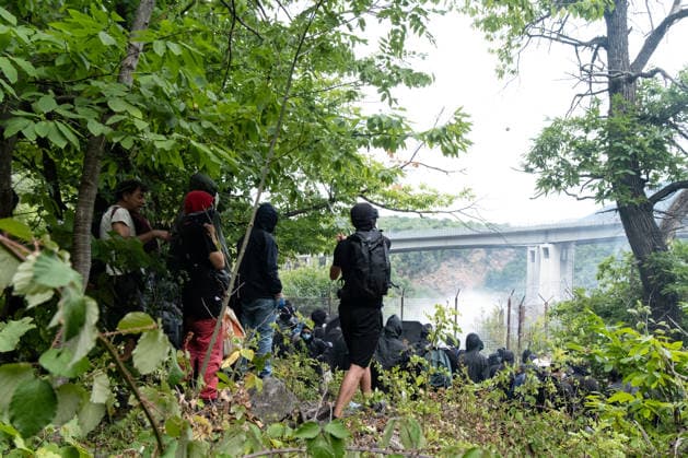 July 25, 2026, Susa, Piedmont, Italy: On July 25, 2026, thousands of people departed from AltaFelicito , a music festival in Venaus, to reach the construction sites of the TAV (High speed rail), a railway project to connect Italy and France. The demonstrators managed to enter the site and there clashed with the police, who responded with tear gas. Many of the buildings inside were put on fire, including two police vehicles. The TAV project has been highly contested during the last 30 years because of environmental damages and increasing costs. Susa Italy  - ZUMAs377 20260725_znp_s377_023 Copyright: xPietroxStariccox