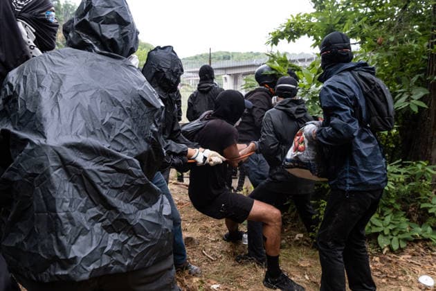 July 25, 2026, Susa, Piedmont, Italy: On July 25, 2026, thousands of people departed from AltaFelicito , a music festival in Venaus, to reach the construction sites of the TAV (High speed rail), a railway project to connect Italy and France. The demonstrators managed to enter the site and there clashed with the police, who responded with tear gas. Many of the buildings inside were put on fire, including two police vehicles. The TAV project has been highly contested during the last 30 years because of environmental damages and increasing costs. Susa Italy  - ZUMAs377 20260725_znp_s377_027 Copyright: xPietroxStariccox