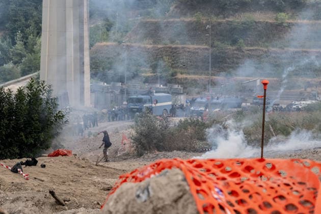 July 25, 2026, Susa, Piedmont, Italy: On July 25, 2026, thousands of people departed from AltaFelicito , a music festival in Venaus, to reach the construction sites of the TAV (High speed rail), a railway project to connect Italy and France. The demonstrators managed to enter the site and there clashed with the police, who responded with tear gas. Many of the buildings inside were put on fire, including two police vehicles. The TAV project has been highly contested during the last 30 years because of environmental damages and increasing costs. Susa Italy  - ZUMAs377 20260725_znp_s377_033 Copyright: xPietroxStariccox