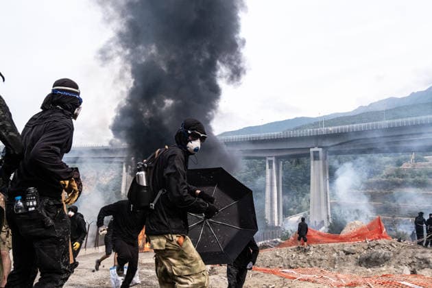 July 25, 2026, Susa, Piedmont, Italy: On July 25, 2026, thousands of people departed from AltaFelicito , a music festival in Venaus, to reach the construction sites of the TAV (High speed rail), a railway project to connect Italy and France. The demonstrators managed to enter the site and there clashed with the police, who responded with tear gas. Many of the buildings inside were put on fire, including two police vehicles. The TAV project has been highly contested during the last 30 years because of environmental damages and increasing costs. Susa Italy  - ZUMAs377 20260725_znp_s377_034 Copyright: xPietroxStariccox