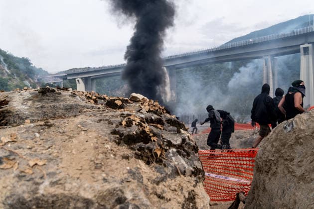 July 25, 2026, Susa, Piedmont, Italy: On July 25, 2026, thousands of people departed from AltaFelicito , a music festival in Venaus, to reach the construction sites of the TAV (High speed rail), a railway project to connect Italy and France. The demonstrators managed to enter the site and there clashed with the police, who responded with tear gas. Many of the buildings inside were put on fire, including two police vehicles. The TAV project has been highly contested during the last 30 years because of environmental damages and increasing costs. Susa Italy  - ZUMAs377 20260725_znp_s377_039 Copyright: xPietroxStariccox