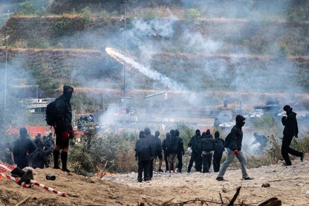 July 25, 2026, Susa, Piedmont, Italy: On July 25, 2026, thousands of people departed from AltaFelicito , a music festival in Venaus, to reach the construction sites of the TAV (High speed rail), a railway project to connect Italy and France. The demonstrators managed to enter the site and there clashed with the police, who responded with tear gas. Many of the buildings inside were put on fire, including two police vehicles. The TAV project has been highly contested during the last 30 years because of environmental damages and increasing costs. Susa Italy  - ZUMAs377 20260725_znp_s377_041 Copyright: xPietroxStariccox