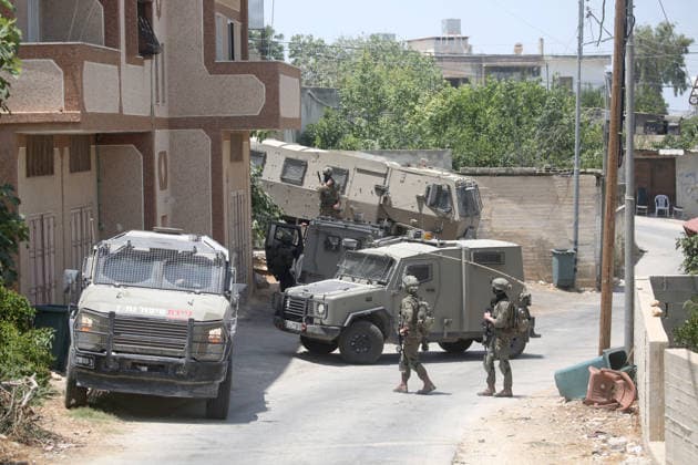 July 25, 2026, Nablus, West Bank, Palestine: Israeli soldiers take positions as they guard the military vehicles during the siege of the home of the Palestinian man who shot a settler in self-defense after a group of Jewish settlers stormed his house. This attack came in retaliation for the killing of two settlers and four Palestinians in Tell, southwest of Nablus in the West Bank. In response, settlers set fire to Palestinian cars and homes in Tell and the neighboring village of Qalqilya Sara. Meanwhile, the Israeli army announced its readiness for a military operation in the northern West Bank, which is under the control of the Palestinian Authority. Nablus Palestine - ZUMAs197 20260725_aaa_s197_228 Copyright: xNasserxishatyehx