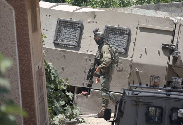 July 25, 2026, Nablus, West Bank, Palestine: Israeli soldiers take positions as they guard the military vehicles during the siege of the home of the Palestinian man who shot a settler in self-defense after a group of Jewish settlers stormed his house. This attack came in retaliation for the killing of two settlers and four Palestinians in Tell, southwest of Nablus in the West Bank. In response, settlers set fire to Palestinian cars and homes in Tell and the neighboring village of Qalqilya Sara. Meanwhile, the Israeli army announced its readiness for a military operation in the northern West Bank, which is under the control of the Palestinian Authority. Nablus Palestine - ZUMAs197 20260725_aaa_s197_230 Copyright: xNasserxishatyehx