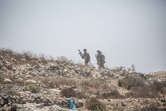 July 25, 2026, Nablus, West Bank, Palestine: Israeli soldiers deployed in the street as they surrounded the home of the Palestinian man who shot a settler in self-defense after a group of Jewish settlers stormed his house. This attack came in retaliation for the killing of two settlers and four Palestinians in Tell, southwest of Nablus in the West Bank. In response, settlers set fire to Palestinian cars and homes in Tell and the neighboring village of Qalqilya Sara. Meanwhile, the Israeli army announced its readiness for a military operation in the northern West Bank, which is under the control of the Palestinian Authority. Nablus Palestine - ZUMAs197 20260725_aaa_s197_231 Copyright: xNasserxishatyehx