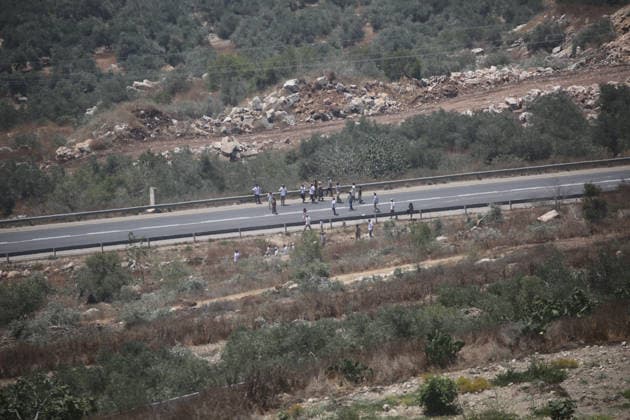 July 25, 2026, Nablus, West Bank, Palestine: Jewish settlers block the road, uprooted olive trees, and destroyed agricultural fields belonging to the village of Tell, southwest of Nablus. This attack came in retaliation for the killing of two settlers and four Palestinians in Tell, southwest of Nablus in the West Bank. In response, settlers set fire to Palestinian cars and homes in Tell and the neighboring village of Qalqilya Sara. Meanwhile, the Israeli army announced its readiness for a military operation in the northern West Bank, which is under the control of the Palestinian Authority. Nablus Palestine - ZUMAs197 20260725_aaa_s197_240 Copyright: xNasserxishatyehx