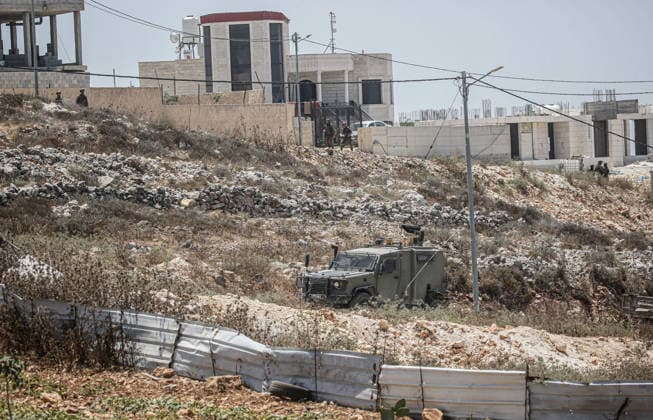 July 25, 2026, Nablus, West Bank, Palestine: Israeli military vehicle seen near the home of the Palestinian man who shot a settler in self-defense after a group of Jewish settlers stormed his house. This attack came in retaliation for the killing of two settlers and four Palestinians in Tell, southwest of Nablus in the West Bank. In response, settlers set fire to Palestinian cars and homes in Tell and the neighboring village of Qalqilya Sara. Meanwhile, the Israeli army announced its readiness for a military operation in the northern West Bank, which is under the control of the Palestinian Authority. Nablus Palestine - ZUMAs197 20260725_aaa_s197_242 Copyright: xNasserxishatyehx