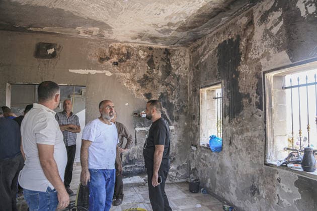 July 25, 2026, Nablus, West Bank, Palestine: Palestinians inspect a burned-out house set on fire by Jewish settlers in the village of Tell, southwest of Nablus in the West Bank. This attack came in retaliation for the killing of two settlers and four Palestinians in Tell, southwest of Nablus in the West Bank. In response, settlers set fire to Palestinian cars and homes in Tell and the neighboring village of Qalqilya Sara. Meanwhile, the Israeli army announced its readiness for a military operation in the northern West Bank, which is under the control of the Palestinian Authority. Nablus Palestine - ZUMAs197 20260725_aaa_s197_251 Copyright: xNasserxishatyehx