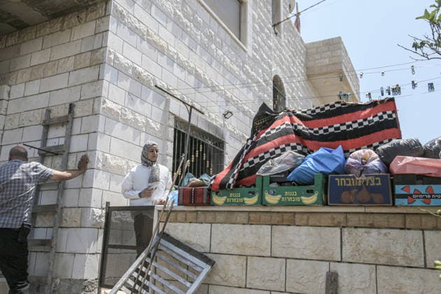 July 25, 2026, Nablus, West Bank, Palestine: Palestinians inspect a burned-out house set on fire by Jewish settlers in the village of Tell, southwest of Nablus in the West Bank. This attack came in retaliation for the killing of two settlers and four Palestinians in Tell, southwest of Nablus in the West Bank. In response, settlers set fire to Palestinian cars and homes in Tell and the neighboring village of Qalqilya Sara. Meanwhile, the Israeli army announced its readiness for a military operation in the northern West Bank, which is under the control of the Palestinian Authority. Nablus Palestine - ZUMAs197 20260725_aaa_s197_252 Copyright: xNasserxishatyehx