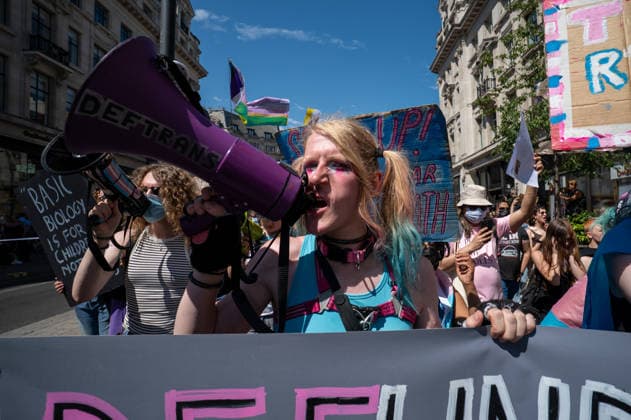 July 25, 2026, London, Westminster, United Kingdom: An activist shouts through a megaphone during the Trans+ Pride London march. Thousands of people joined the seventh annual Trans+ Pride march and rally in central London. The event celebrated the trans community while promoting equality and challenging discrimination through visibility and collective action. The march set off from Langham Place at 2 p.m., paused at three points for speeches and to welcome additional participants, and concluded with a rally and further speeches in Trafalgar Square. London United Kingdom - ZUMAs197 20260725_aaa_s197_282 Copyright: xJamesxWilloughbyx