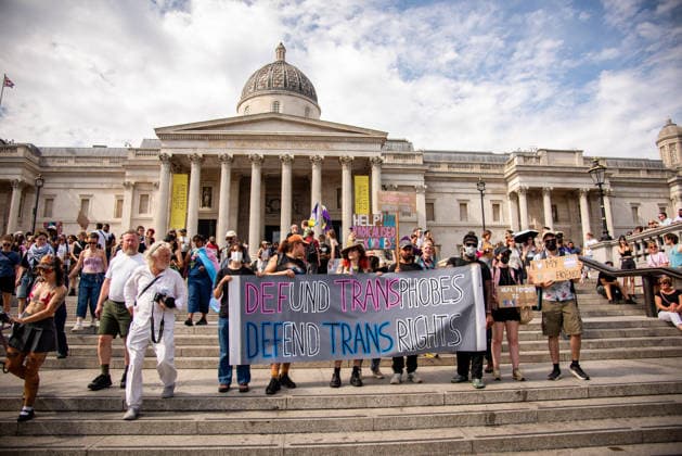 July 25, 2026, London, United Kingdom: Protestors hold a large banner at Trafalgar Square during the London Trans+ Pride 2026 Parade. New EHRC rules limiting single-sex spaces to biological sex created a bleak backdrop for this year s London Trans+ Pride march. London United Kingdom - ZUMAs197 20260725_aaa_s197_322 Copyright: xLoredanaxSangiulianox