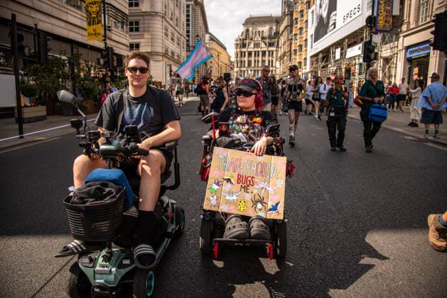July 25, 2026, London, United Kingdom: A protestor holds a placard during the London Trans+ Pride 2026 Parade. New EHRC rules limiting single-sex spaces to biological sex created a bleak backdrop for this year s London Trans+ Pride march. London United Kingdom - ZUMAs197 20260725_aaa_s197_325 Copyright: xLoredanaxSangiulianox