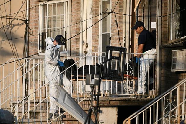 Police shoot armed suspect in Queens after house fire NEW YORK, NY, UNITED STATES - JULY 25: NYC Office of the Chief Medical Examiner personnel removed two bodies from inside of the home after 33-year-old Kegan Thomas allegedly wielded a shotgun and was critically wounded by NYPD officers after two people were found dead inside a house that was allegedly set ablaze by Thomas in Far Rockaway, Queens, New York, United States on Saturday, July 25, 2026. Saturday afternoon NYPD and FDNY responded to the incident at the home at 25-33 Ocean Crest Boulevard. Inside of the suspects tactical vest, shotgun shells were found when he was taken into custody. Two people were found dead inside of the home which was allegedly set on fire by the suspect. Ky  Copyright: x2026xAnadoluxKylexMazzax