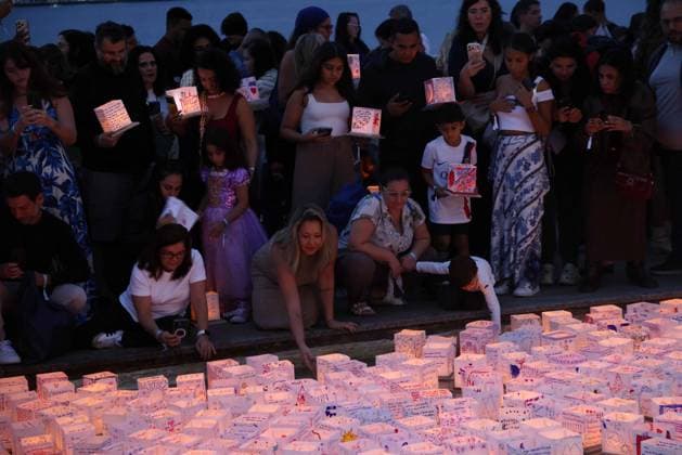 July 25, 2026, Rio De Janeiro, Rio De Janeiro, Brazil: Hundreds came to the inaugural Water Lantern Festival at the Museum of Tomorrow (Museu do AmanhoÂ£) in Rio de Janeiro, Brazil to release illuminated water lanterns fitted with small LED lights. Participants personalized the floating lanterns with messages before setting them on the water at sunset, creating a display intended to symbolize hope, healing, remembrance and unity. The festival, which is held annually in dozens of cities around the world, including New York, Los Angeles, Toronto, London and Sydney, made its Brazil debut in Rio de Janeiro. Rio De Janeiro Brazil - ZUMAk251 20260725_znp_k251_016 Copyright: xBobxKarpx