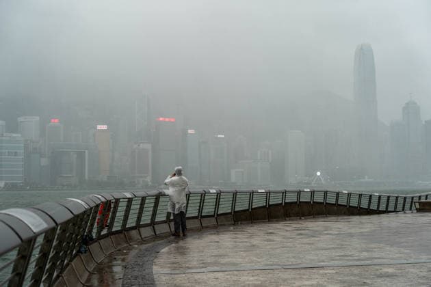HONGKONG-TYPHOON NOUL A man looks at the Hong Kong Skyline during typhoon Noul in Hong Kong, July 26, 2026. NEXPHER Vernon Yuen HONG KONG