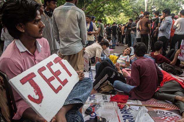 July 25, 2026, New Delhi, India: NEW DELHI, INDIA Ã¢â‚¬ JULY 25, 2026: Student protesters celebrate at Jantar Mantar following the resignation of India s Union Education Minister Dharmendra Pradhan, in New Delhi, India. Demonstrators hold placards reading Jeet ( Victory ), wave the Indian national flag and climb police barricades after the announcement, following days of nationwide protests over alleged irregularities in the country s education system. New Delhi India - ZUMAq101 20260725_zna_q101_372 Copyright: xAmitxShuklax