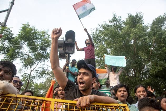 July 25, 2026, New Delhi, India: NEW DELHI, INDIA Ã¢â‚¬ JULY 25, 2026: Student protesters celebrate at Jantar Mantar following the resignation of India s Union Education Minister Dharmendra Pradhan, in New Delhi, India. Demonstrators hold placards reading Jeet ( Victory ), wave the Indian national flag and climb police barricades after the announcement, following days of nationwide protests over alleged irregularities in the country s education system. New Delhi India - ZUMAq101 20260725_zna_q101_377 Copyright: xAmitxShuklax