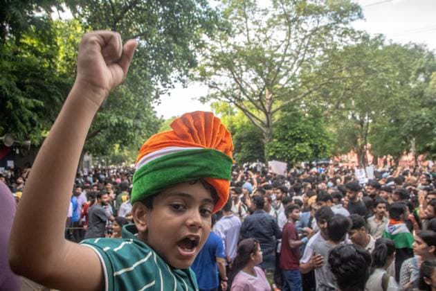 July 25, 2026, New Delhi, India: NEW DELHI, INDIA Ã¢â‚¬ JULY 25, 2026: Student protesters celebrate at Jantar Mantar following the resignation of India s Union Education Minister Dharmendra Pradhan, in New Delhi, India. Demonstrators hold placards reading Jeet ( Victory ), wave the Indian national flag and climb police barricades after the announcement, following days of nationwide protests over alleged irregularities in the country s education system. New Delhi India - ZUMAq101 20260725_zna_q101_382 Copyright: xAmitxShuklax