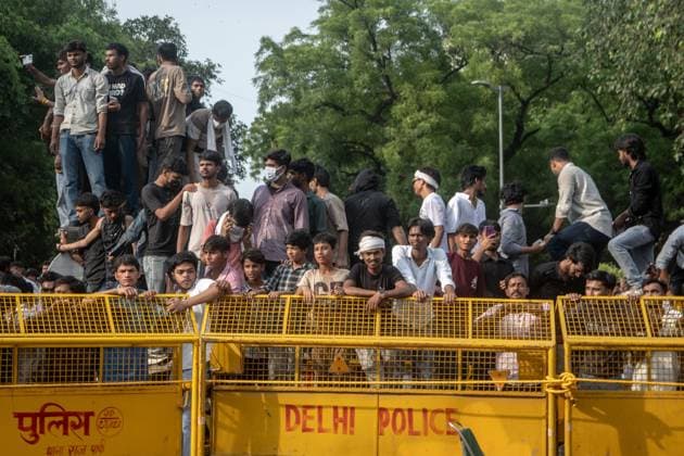 July 25, 2026, New Delhi, India: NEW DELHI, INDIA Ã¢â‚¬ JULY 25, 2026: Student protesters celebrate at Jantar Mantar following the resignation of India s Union Education Minister Dharmendra Pradhan, in New Delhi, India. Demonstrators hold placards reading Jeet ( Victory ), wave the Indian national flag and climb police barricades after the announcement, following days of nationwide protests over alleged irregularities in the country s education system. New Delhi India - ZUMAq101 20260725_zna_q101_384 Copyright: xAmitxShuklax