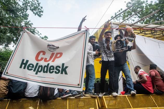 July 25, 2026, New Delhi, India: NEW DELHI, INDIA Ã¢â‚¬ JULY 25, 2026: Student protesters celebrate at Jantar Mantar following the resignation of India s Union Education Minister Dharmendra Pradhan, in New Delhi, India. Demonstrators hold placards reading Jeet ( Victory ), wave the Indian national flag and climb police barricades after the announcement, following days of nationwide protests over alleged irregularities in the country s education system. New Delhi India - ZUMAq101 20260725_zna_q101_388 Copyright: xAmitxShuklax