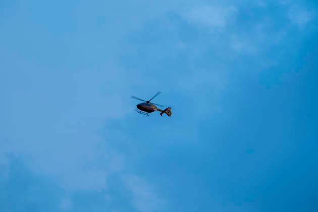 A firefighting helicopter flies over the area affected by the Sierra Oeste wildfire in the Madrid region dropping water on the fire front that forced the evacuation of thousands of people in the region. July 25, 2026. (202607251324)