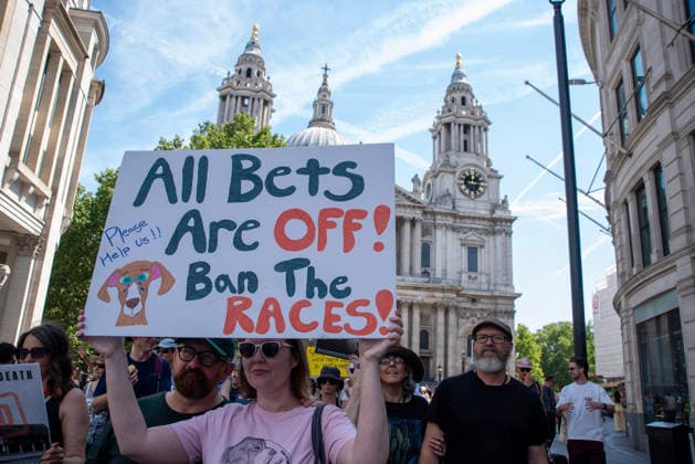 Demonstration against Greyhound race in London, UK - 25 Jul 2026 An animal rights activist holds a placard during a protest march. Animal rights activists gathered outside of the Greyhound Board of Great Britain (GBGB) headquarters near the St Paul s Cathedral. The Greyhound Board of Great Britain (GBGB) serves as the governing and regulatory body for licensed greyhound racing in England because it was banned previously in Wales and Scotland. The protesters demand from the UK Government to ban the Greyhound racing immediately because 161 dog died during and after the race, just in 2025. London United Kingdom Copyright: xKrisztianxElekx xSOPAxImagesx SSS_20260725_GREYHOUND_DEMO_0011005066