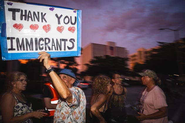 July 25, 2026, Naples, Florida, USA: Protestors hold signs in protest of the IMMIGRATION AND CUSTOMS ENFORCEMENT (ICE) tactics and treatment of community members. Naples USA - ZUMAd256 20260725_znp_d256_035 Copyright: xDavexDeckerx