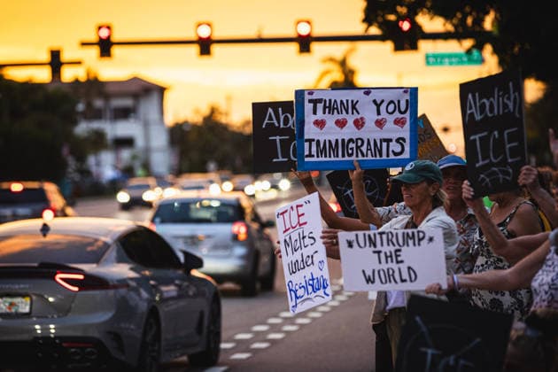 July 25, 2026, Naples, Florida, USA: Protestors hold signs in protest of the IMMIGRATION AND CUSTOMS ENFORCEMENT (ICE) tactics and treatment of community members. Naples USA - ZUMAd256 20260725_znp_d256_038 Copyright: xDavexDeckerx
