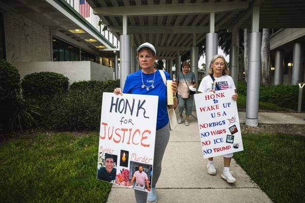 July 25, 2026, Naples, Florida, USA: Protestors hold signs in protest of the IMMIGRATION AND CUSTOMS ENFORCEMENT (ICE) tactics and treatment of community members. Naples USA - ZUMAd256 20260725_znp_d256_039 Copyright: xDavexDeckerx
