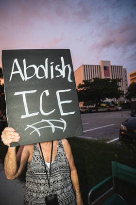 July 25, 2026, Naples, Florida, USA: Protestors hold signs in protest of the IMMIGRATION AND CUSTOMS ENFORCEMENT (ICE) tactics and treatment of community members. Naples USA - ZUMAd256 20260725_znp_d256_043 Copyright: xDavexDeckerx