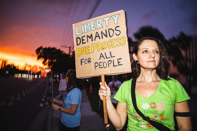 July 25, 2026, Naples, Florida, USA: Protestors hold signs in protest of the IMMIGRATION AND CUSTOMS ENFORCEMENT (ICE) tactics and treatment of community members. Naples USA - ZUMAd256 20260725_znp_d256_045 Copyright: xDavexDeckerx