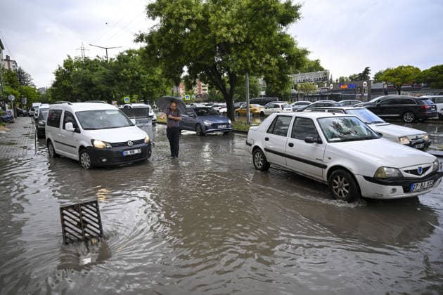 Heavy rainfall causes localized flooding in Turkiye s capital Ankara during summer ANKARA, TURKIYE – JULY 25: Vehicles move through a flooded street as a pedestrian walks with an umbrella following heavy rainfall during summer in Ankara, Turkiye, on July 25, 2026. Heavy rain triggered localized flooding on several roads, causing traffic disruptions across the city. Utku Ucrak Anadolu Ankara Turkey. Editorial use only. Please get in touch for any other usage.  Copyright: x2026xAnadoluxUtkuxUcrakx