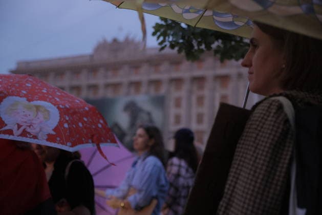 Protest Against Ukrainian President Zelenskiy s Decision To Replace Fedorov As Defence Minister, In Kharkiv Residents holding umbrellas gather during a protest against Ukrainian President Zelenskiy s decision to replace Fedorov as Defence Minister in Kharkiv, Ukraine, on July 25, 2026. The demonstration took place in the evening in central Kharkiv, with participants carrying colorful umbrellas including red and purple designs. Multiple people assembled in the public square with historical architecture visible in the background. Kharkiv Kharkiv Oblast Ukraine  Copyright: xYevhenxTitovx originalFilename: titov-kharkivr260725_npFPU.jpg