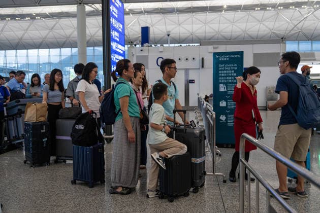 HONGKONG-TYPHOON NOUL Travelers lining up to check in inside Terminal 1 at Hong Kong International Airpot during typhoon Noul in Hong Kong, July 26, 2026. NEXPHER Vernon Yuen HONG KONG