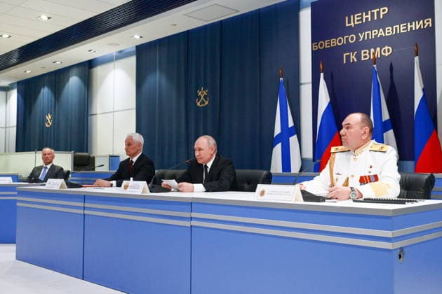 RUSSIA, ST PETERSBURG - JULY 26, 2026: Russian Navy Commander-in-Chief Admiral Alexander Moiseyev, Russia s President Vladimir Putin, and Defence Minister Andrei Belousov (R-L) meet with servicemen at the Admiralty Building on Russian Navy Day. Alexei Danichev TASS  95485683