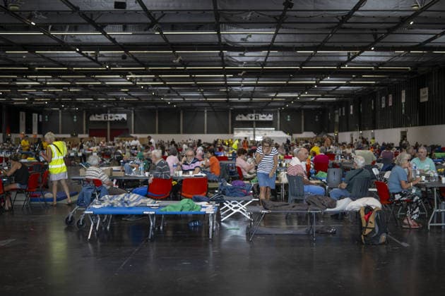 Bordeaux Exhibition Centre Shelters Evacuees from Wildfires BORDEAUX, FRANCE - JULY 26 : The Parc des Expositions de Bordeaux-Lac, located on Cours Jules Ladoumegue, serves as one of the main reception centers for people evacuated due to severe wildfires affecting the Gironde department in southwestern France, providing temporary accommodation, basic services, and logistical support through Gate M as firefighters continue efforts to contain the blaze on July 26, 2026 in Bordeaux, France. Authorities have urged residents to follow official instructions until the situation is brought under control in Bordeaux. Lorena Sopena Lopez Anadolu Bordeaux France. Editorial use only. Please get in touch for any other usage.  Copyright: x2026xAnadoluxLorenaxSopenaxLopezx