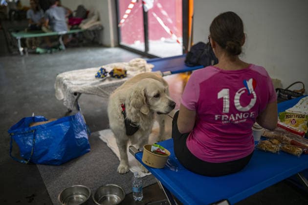 Bordeaux Exhibition Centre Shelters Evacuees from Wildfires BORDEAUX, FRANCE - JULY 26 : The Parc des Expositions de Bordeaux-Lac, located on Cours Jules Ladoumegue, serves as one of the main reception centers for people evacuated due to severe wildfires affecting the Gironde department in southwestern France, providing temporary accommodation, basic services, and logistical support through Gate M as firefighters continue efforts to contain the blaze on July 26, 2026 in Bordeaux, France. Authorities have urged residents to follow official instructions until the situation is brought under control in Bordeaux. Lorena Sopena Lopez Anadolu Bordeaux France. Editorial use only. Please get in touch for any other usage.  Copyright: x2026xAnadoluxLorenaxSopenaxLopezx