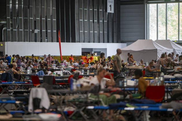 Bordeaux Exhibition Centre Shelters Evacuees from Wildfires BORDEAUX, FRANCE - JULY 26 : The Parc des Expositions de Bordeaux-Lac, located on Cours Jules Ladoumegue, serves as one of the main reception centers for people evacuated due to severe wildfires affecting the Gironde department in southwestern France, providing temporary accommodation, basic services, and logistical support through Gate M as firefighters continue efforts to contain the blaze on July 26, 2026 in Bordeaux, France. Authorities have urged residents to follow official instructions until the situation is brought under control in Bordeaux. Lorena Sopena Lopez Anadolu Bordeaux France. Editorial use only. Please get in touch for any other usage.  Copyright: x2026xAnadoluxLorenaxSopenaxLopezx
