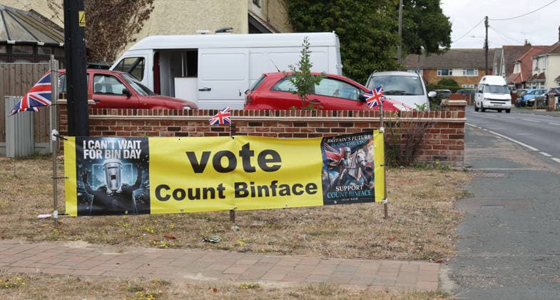 July 26, 2026, Clacton-On-Sea, Essex, UK: Clacton-On-Sea, UK. A large Count Binface campaign banner is displayed outside a house in Kirby Cross, Essex. Nigel Farage has resigned his seat and is now campaigning to be re-elected in the Clacton constituency at the upcoming by-election on the 13th August. Clacton-On-Sea UK  - ZUMAl94_ 20260726_zaf_l94_005 Copyright: xJacquelinexLawriex