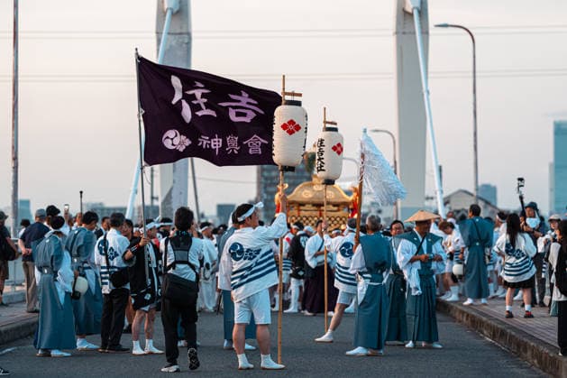 General view, July 26, 2026 - Participants carry a portable shrine (mikoshi) during the Mikoshi Togyo procession of the Sumiyoshi Matsuri at Sumiyoshi Taisha in Osaka, Japan. The annual procession is one of the festival s main events, as worshippers parade the sacred mikoshi through the surrounding streets as part of a centuries-old Shinto tradition.  aflo_339206545