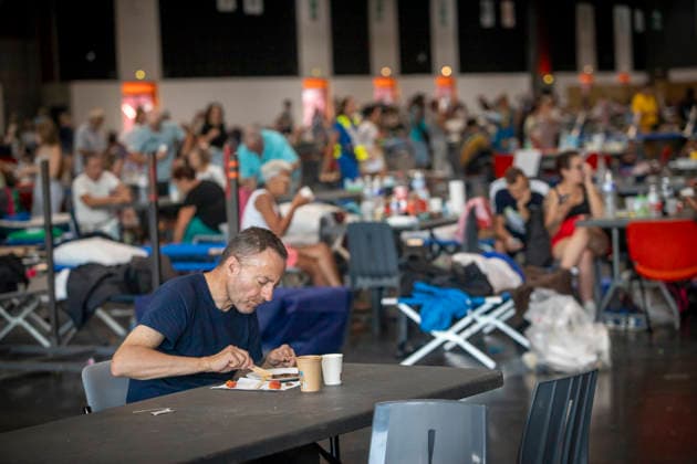 Thousands Of Gironde Wildfire Evacuees Sheltered At The Bordeaux Exhibition Centre Thousands of people evacuated from their homes rest at the Bordeaux Exhibition Centre, which has been converted into a temporary emergency shelter following a major wildfire affecting the Gironde department in southwestern France on Saturday. French authorities have transformed the exhibition halls into an emergency reception facility to accommodate families displaced from several municipalities, providing medical assistance, food and psychological support, while firefighters continue efforts to contain the fire, which has forced the evacuation of tens of thousands of people. In Bordeaux, France, on July 26, 2026. Burdeaux France  Copyright: xAlbertxLlopx originalFilename: salame-thousand260726_npyXY.jpg