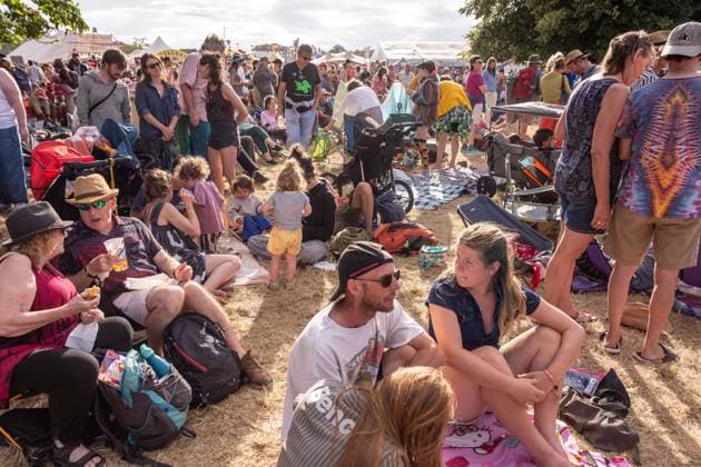 July 26, 2026, Corsham, Wiltshire, England: Festival goers enjoy a sunny Saturday at WOMAD Festival at Neston Park in Wiltshire. Corsham United Kingdom  - ZUMAr169 20260726_zip_r169_011 Copyright: xRodxHarbinsonx