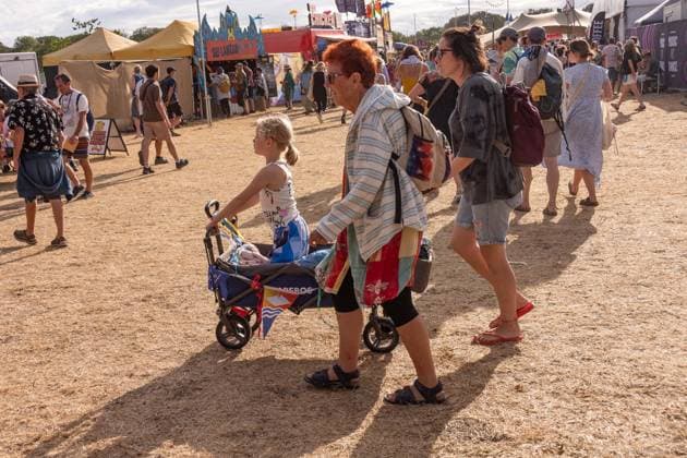 July 26, 2026, Corsham, Wiltshire, England: Festival goers enjoy a sunny Saturday at WOMAD Festival at Neston Park in Wiltshire. Corsham United Kingdom  - ZUMAr169 20260726_zip_r169_014 Copyright: xRodxHarbinsonx