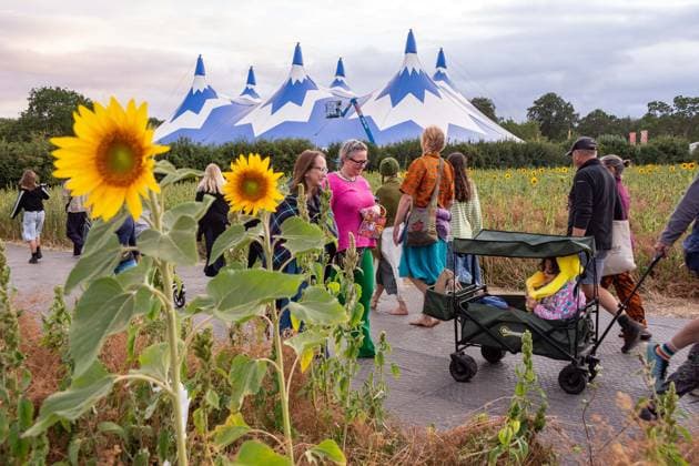 July 26, 2026, Corsham, Wiltshire, England: Festival goers enjoy a sunny Saturday at WOMAD Festival at Neston Park in Wiltshire. Corsham United Kingdom  - ZUMAr169 20260726_zip_r169_025 Copyright: xRodxHarbinsonx
