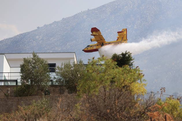 Firefighters battle wildfire near Italy s Palermo PALERMO, ITALY - JULY 26: Firefighter crews launched an aerial and ground response to contain a wildfire that broke out in scrubland near Torretta, outside Palermo on the island of Sicily, Italy on July 26, 2026. Fire engines and two firefighting aircraft were deployed as the blaze threatened nearby residential areas. Alberto Lo Bianco Anadolu Sicily Italy. Editorial use only. Please get in touch for any other usage.  Copyright: x2026xAnadoluxAlbertoxLoxBiancox