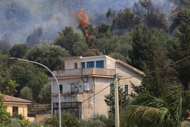 Firefighters battle wildfire near Italy s Palermo PALERMO, ITALY - JULY 26: Firefighter crews launched an aerial and ground response to contain a wildfire that broke out in scrubland near Torretta, outside Palermo on the island of Sicily, Italy on July 26, 2026. Fire engines and two firefighting aircraft were deployed as the blaze threatened nearby residential areas. Alberto Lo Bianco Anadolu Sicily Italy. Editorial use only. Please get in touch for any other usage.  Copyright: x2026xAnadoluxAlbertoxLoxBiancox