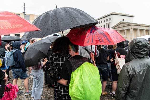 July 26, 2026, Berlin, Germany: BERLIN, GERMANY Ã¢â‚¬ JULY 26, 2026: People attend a vigil at the Brandenburg Gate in Berlin, Germany, following the deadly attack near the city s Christopher Street Day Pride celebrations a day earlier. Mourners laid flowers, candles, signs and LGBTQ+ pride flags in memory of the victims after a vehicle drove into a crowd, killing one person and injuring dozens. German authorities continued searching for the main suspect, identified as Abdul Ballout, whom police said had ties to Islamist extremist circles. Berlin Germany - ZUMAq101 20260726_zna_q101_110 Copyright: xAndro SxTrujillox