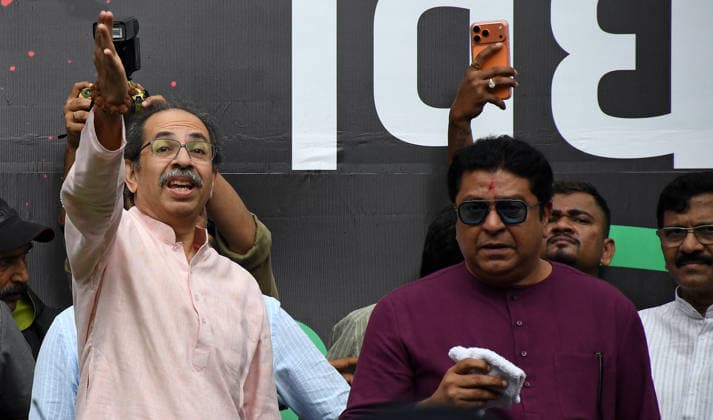 Celebrations after the resignation of Union Education Minister Dharmendra Pradhan in Mumbai, India - 26 Jul 2026 Indian politician and Shiv Sena s (UBT) chief Uddhav Thackeray (L) gestures with his hand as founder and chairman of Maharashtra Navnirman Sena (MNS) Raj Thackeray (R) looks on during the celebration held after the resignation of Union Education Minister Dharmendra Pradhan. Youth led Cockroach Janata Party (CJP) protest which lasted for 36 days concluded on July 25 2026 after the government accepted the key demands put forth by leaders of Cockroach Janata Party (CJP) alongside resignation of Union Education Minister Dharmendra Pradhan in alleged paper leaks and irregularities found in major national medical entrance examinations. Copyright: xAshishxVaishnavx xSOPAxImagesx AVaishnav_Celebration after resignation of Union Education Minister Dharmendra Pradhan in Mumbai(7)